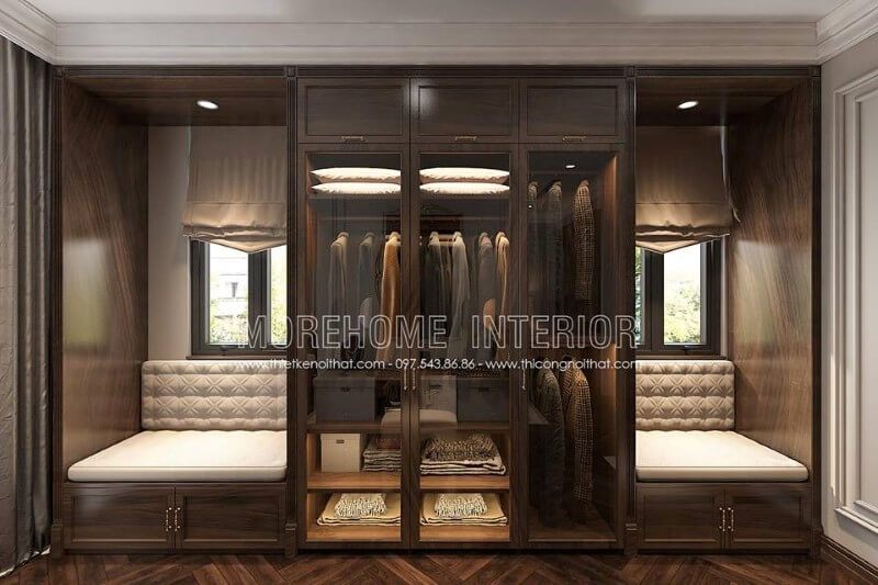 Thiết kế tủ quần áo gỗ óc chó 3 cánh bằng kính cường lực, liền kề được bố trí thêm chỗ ngồi tạo sự thoải mái và thuận tiện hơn cho chủ nhân ngôi nhà